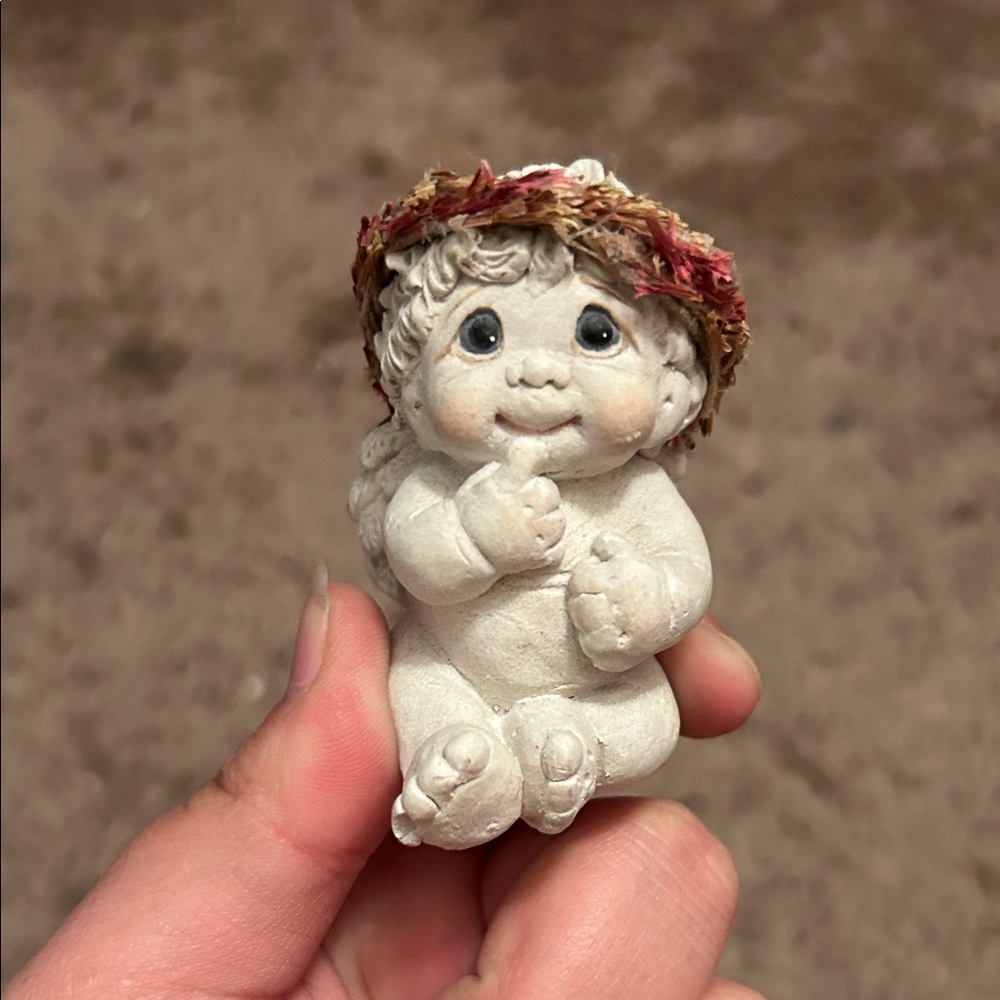 Adorable Figurine with Floral Hat